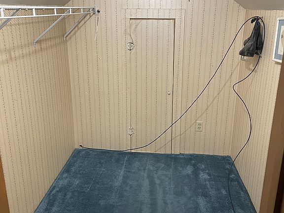 Walk in closet attached to bedroom