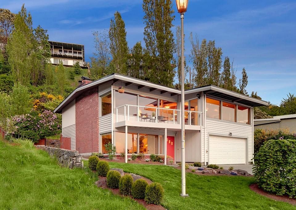 Front of house has water views from every window. Grass has been removed and replaced with drought resistant plants.