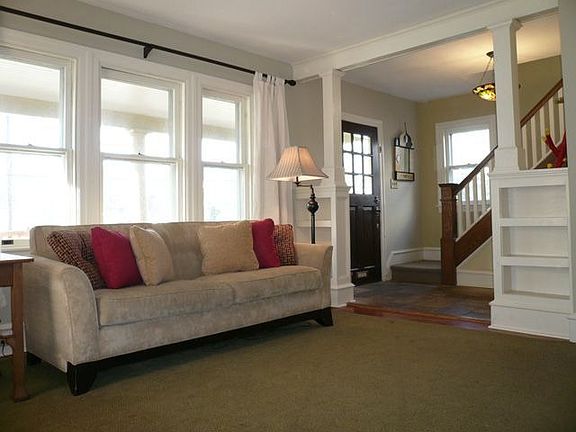 Living Room with wood floors and built-in bookshelves