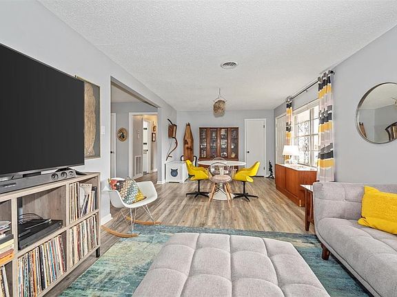 View of living room. Notice the coat closet near the front door.