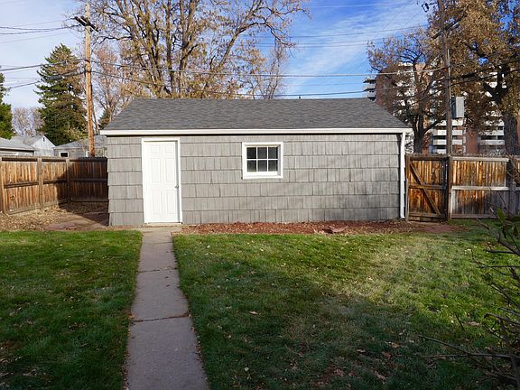 Fenced in backyard with detached 2 car garage