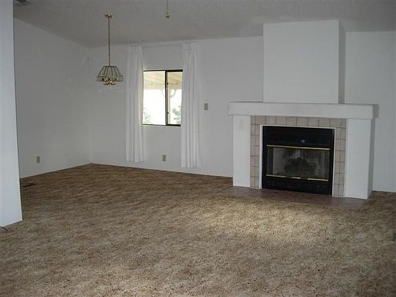 Open floor plan and raised ceilings in Living and Dining Rooms