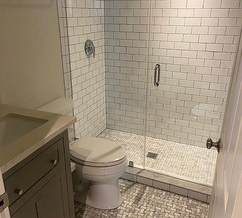 Main floor bathroom (one bathroom on each level), all remodeled with modern finishes
