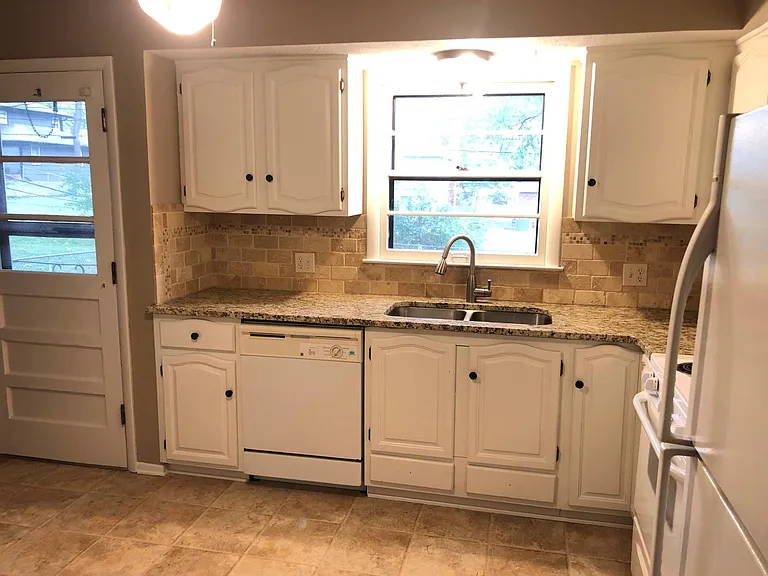 Kitchen with granite countertops.