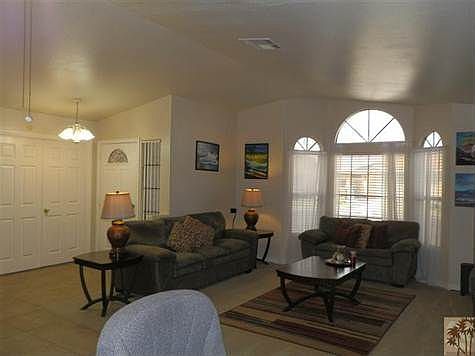 Generous Great Room w/Vaulted Ceiling and Sunburst Windows!