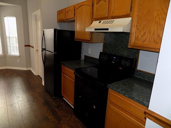 kitchen with new ceramic glass top range and new refridgerat