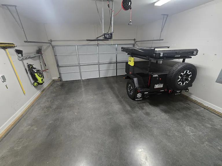 Spacious two-car garage with lots of additional storage space.