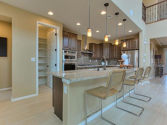 Built-in stainless steel appliances and a large pantry bring functionality and convenience to the Mo
