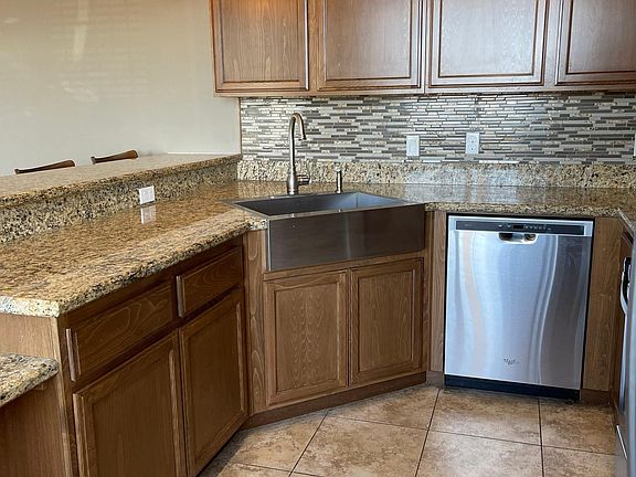 farm style sink, stainless steel dishwasher, granite countertops