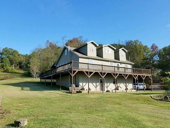 Beautiful yard leading up to the back of the home....as the wrap around porch follows to the back of the home...enjoy the views on a beautiful afternoon swinging on the swing!