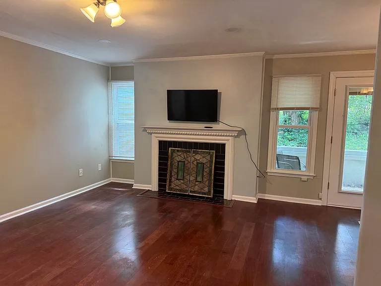 Family room is an L shape with the dining room. 11'x21' The flat screen TV stays with the unit and ready to be used.