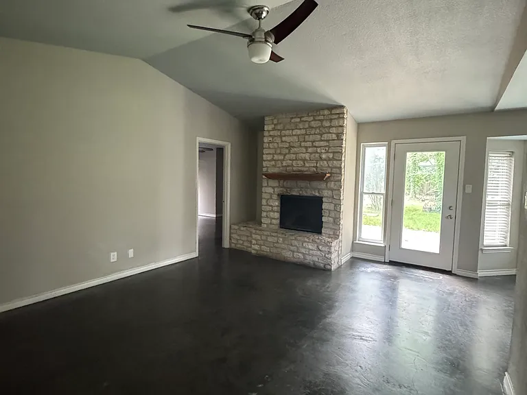Living room with wood burning fireplace