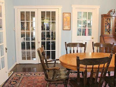 Dining room, looking towards mudroom (right) and living room (left). Open door on the far left is to downstairs bedroom/study.