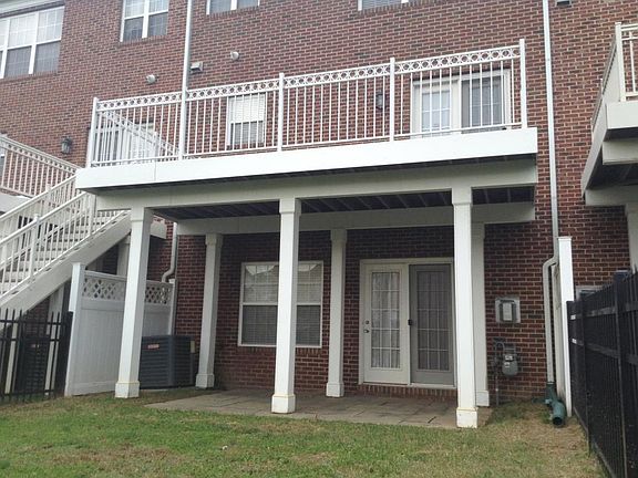 Rear of home with deck and pation