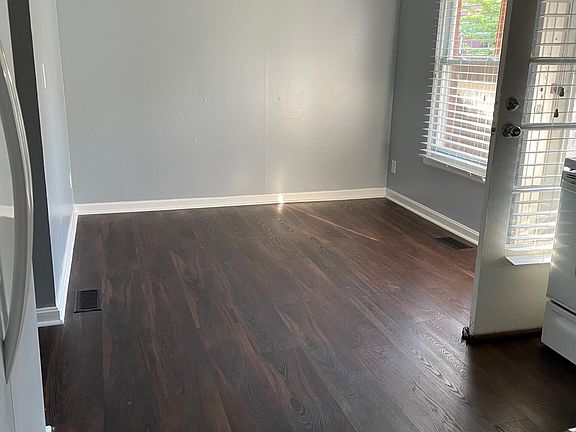 Dining room with dark laminated floor