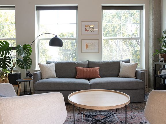 Living Room with tons of natural light. All shades are top-down/bottom-up shades on all windows for privacy when needed.