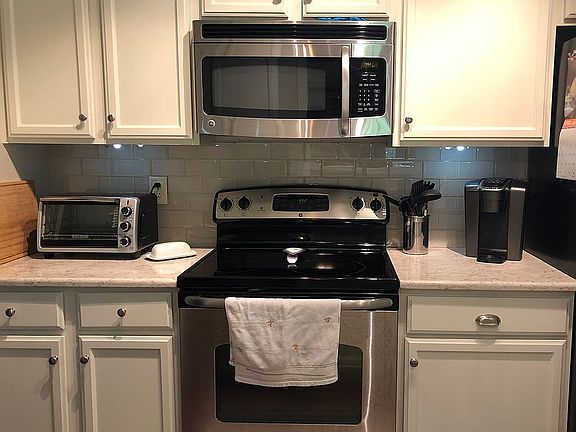 Glass subway tile backsplash