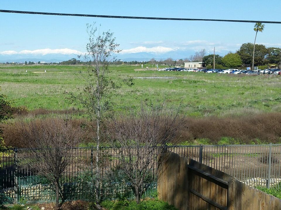 view from master bedroom balcony, showing snow covered mountains