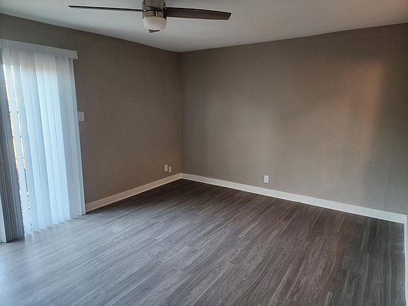 living room with remote control ceiling fan