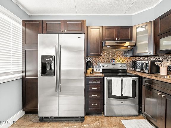 Kitchen: Newer Built-In Pantry, Cabinets and Cupboards. Range, Refrigerator, Dishwasher, Microwave, Keurig, Air Fryer, Toaster.