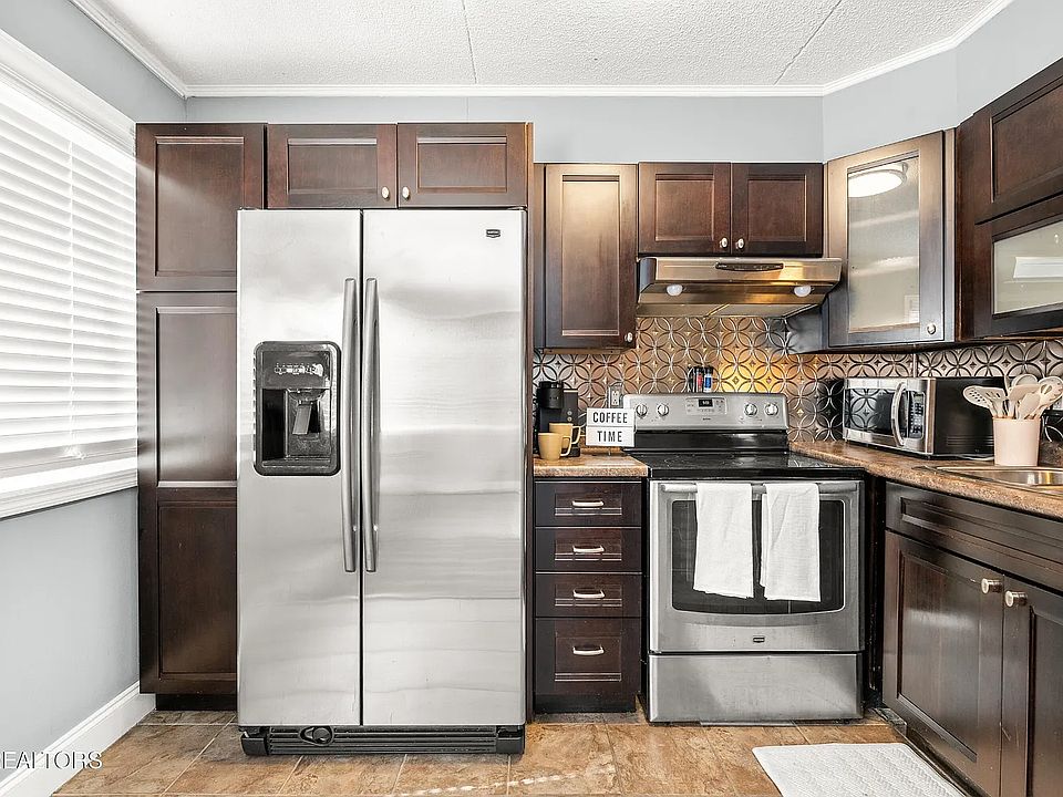 Kitchen: Newer Built-In Pantry, Cabinets and Cupboards. Range, Refrigerator, Dishwasher, Microwave, Keurig, Air Fryer, Toaster.