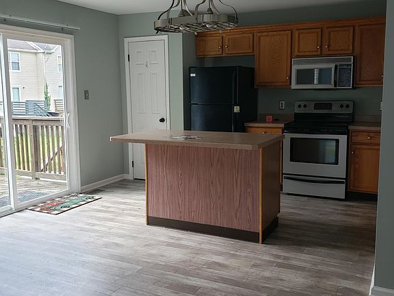 Kitchen with pantry, dishwasher, vinyl plank flooring