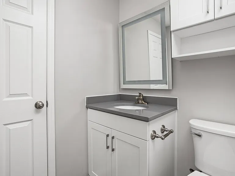Guest bathroom with white vanity