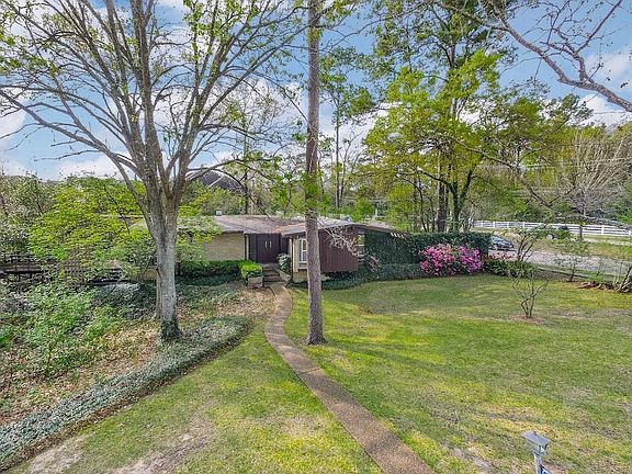 Mid-century Modern design on amazing tree lined street.