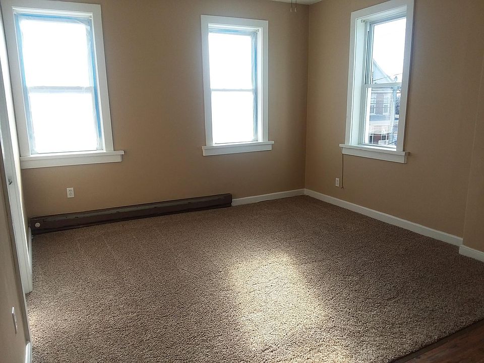 Living room. 3 large windows for natural light
