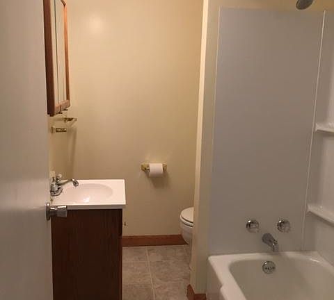 Full bathroom with tub and shower.