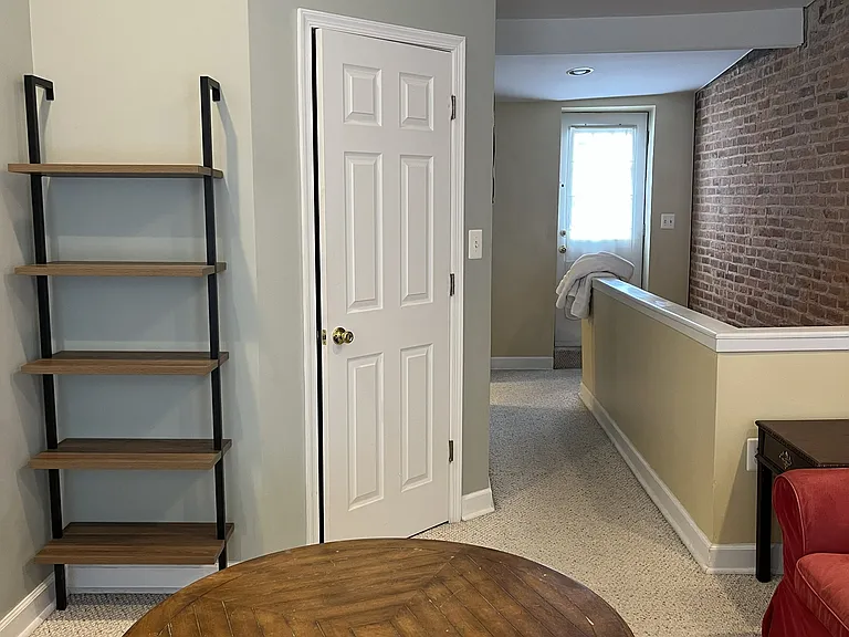 Third floor bedroom with walk-in closet, open area previously used as entertainment area