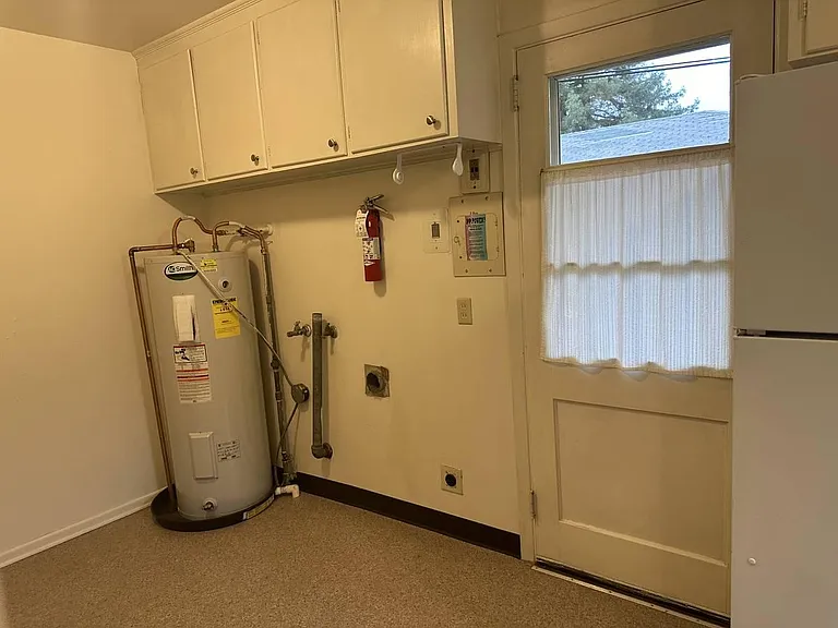 Washer & Dryer will be between hotwater heater and door to the back yard.