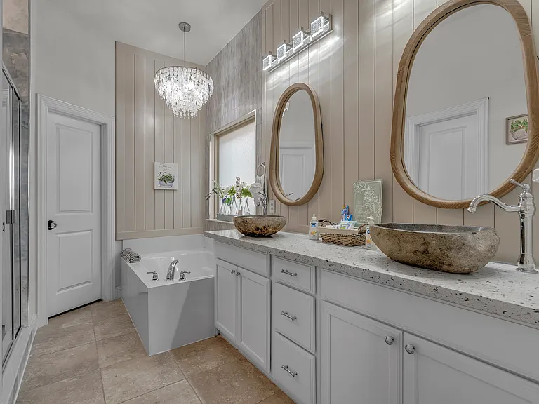Master bathroom suite remodel 2024. Large deep soaking tub plus walk-in shower, tiled ceiling to floor, and double stone vanity.