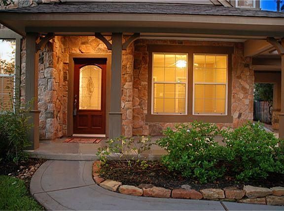 This large, welcoming front porch is the perfect place to greet your neighbors and friends.