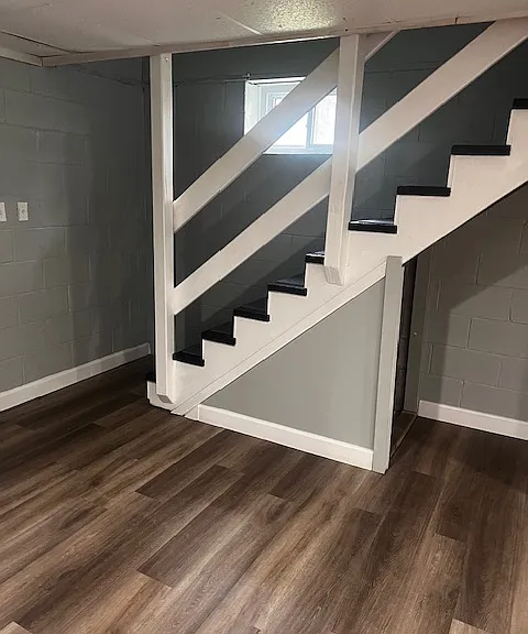 Finished basement, showing staircase to upper story