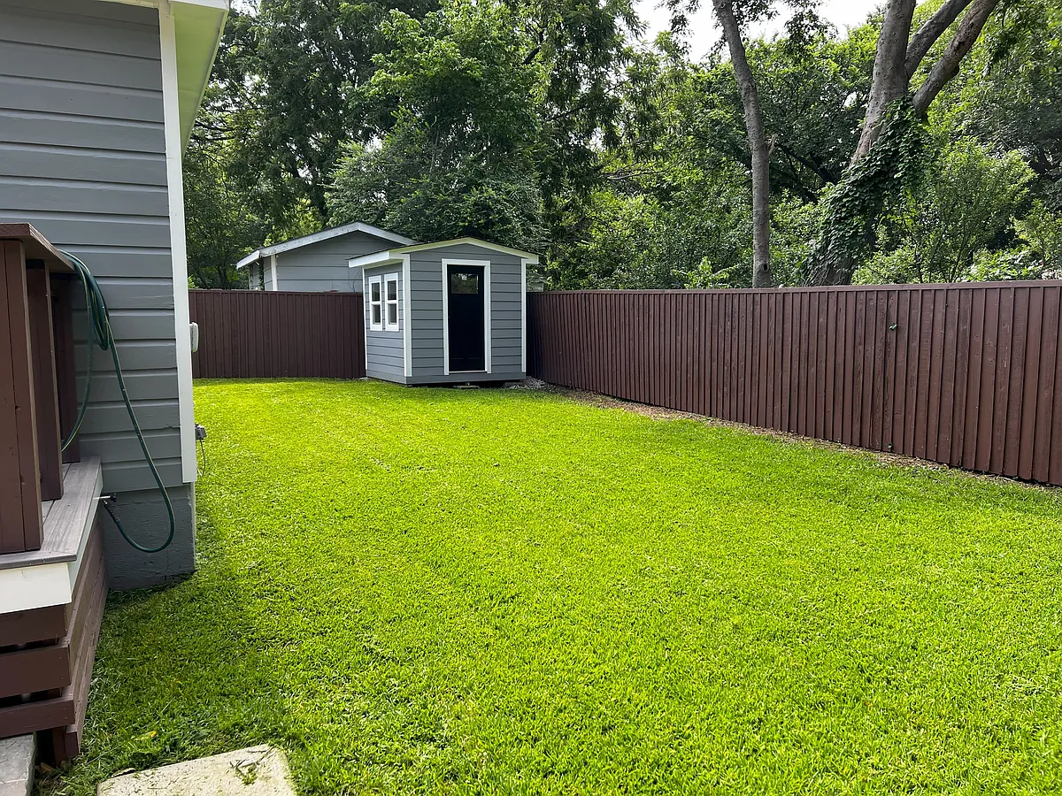 Spacious fenced backyard with secured storage - 1001 Largent St