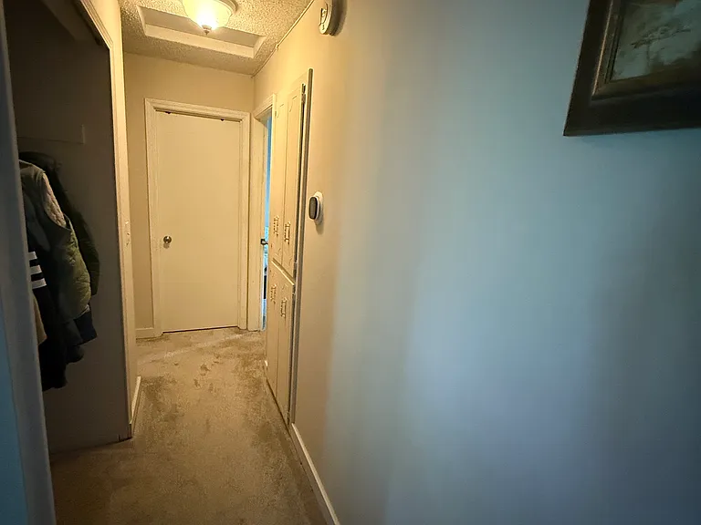 Upstairs hallway leading to the bathroom & bedrooms (hall closet doors temporarily removed)