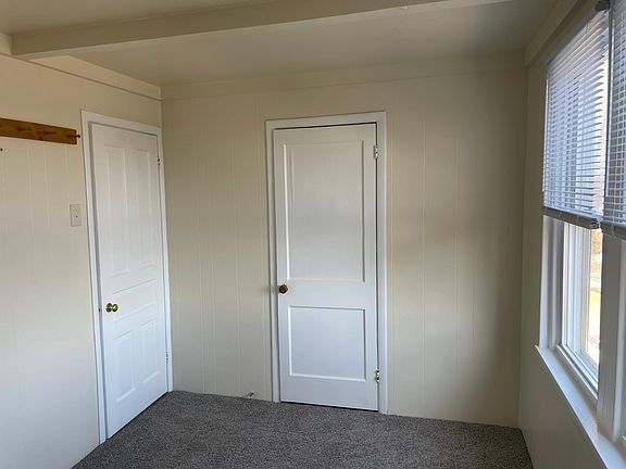 Bedroom (living room door to left, closet door center)