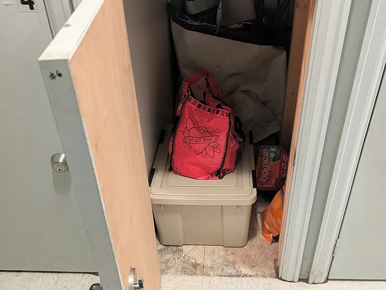 Keyed storage locker that comes with the unit, located in shared laundry room