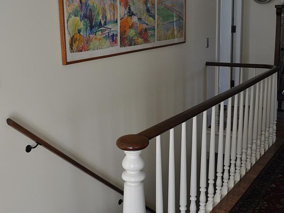 hallway within apartment, at top of stairs
