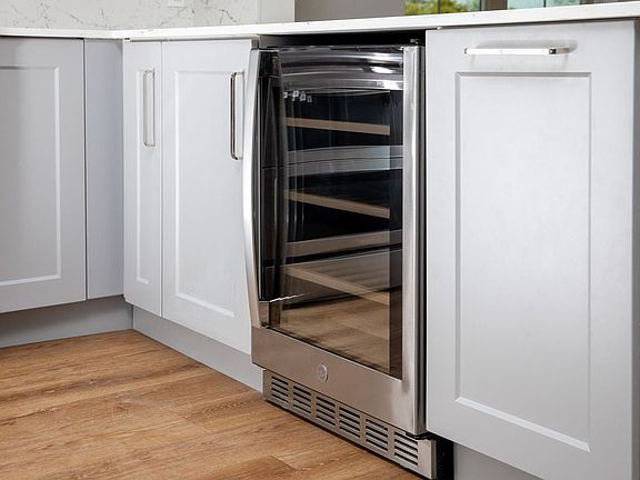 Signature Collection kitchen with stainless steel wine fridge