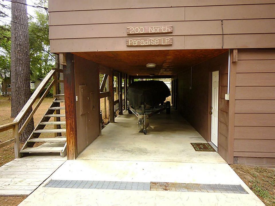 Carport underneath house; 1989 Baja boat negotiable with offer