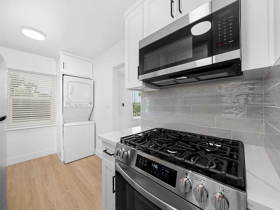 Built In Microwave Above Stove. Stack Washer and Dryer.