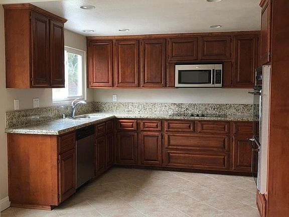 Large kitchen overlooking backyard