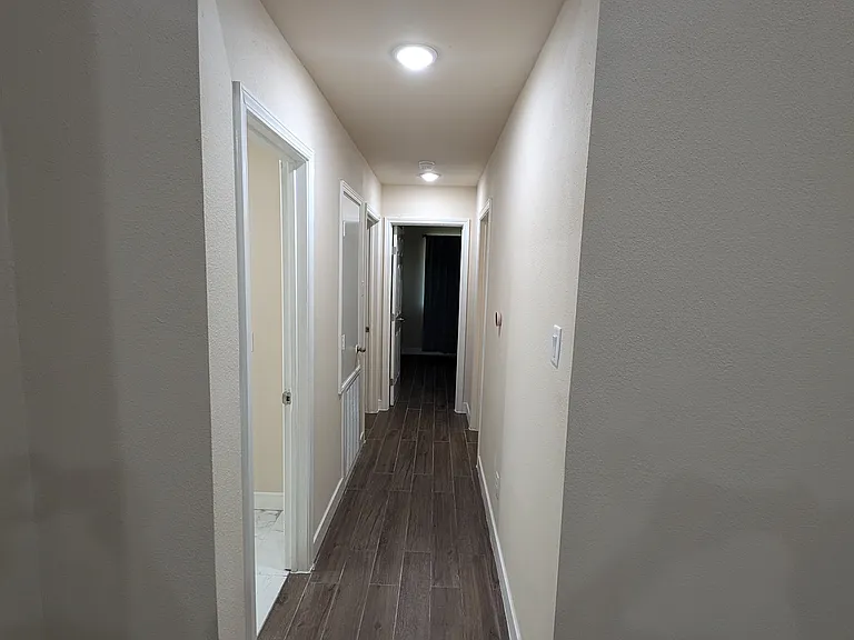 Hallway to all 3 bedrooms