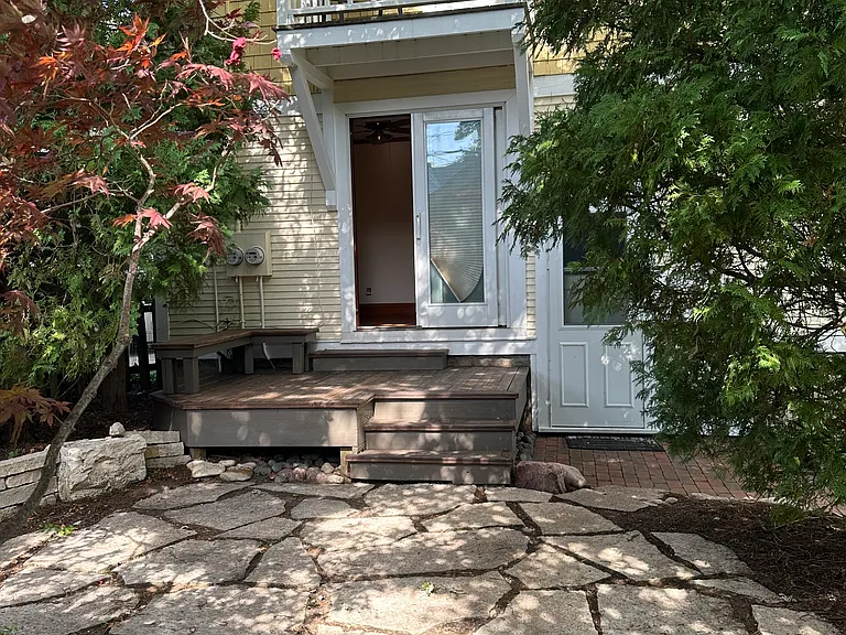 view of patio and deck from 2nd BR