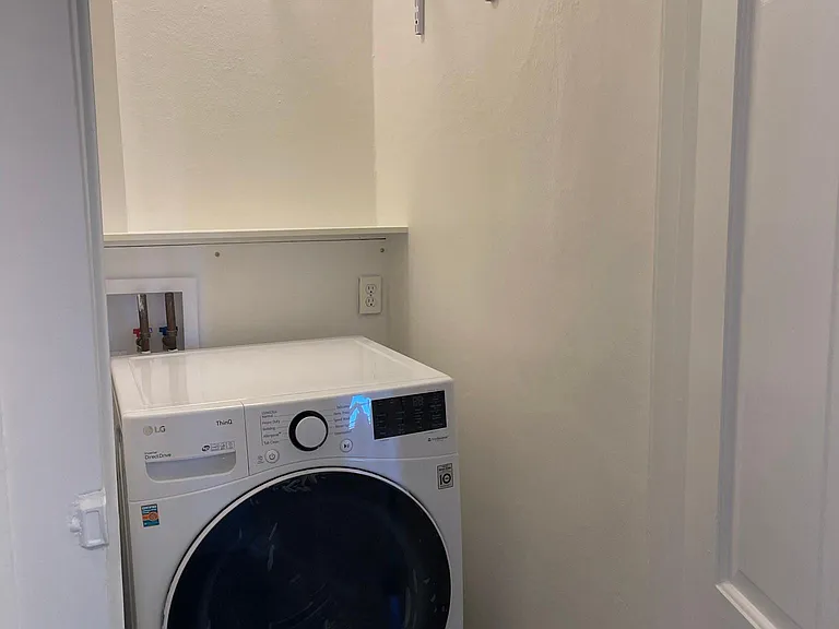 Adjacent to the Bonus Room/Office, a large closet with additional storage and the included washing machine.