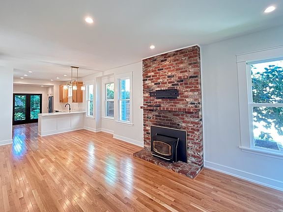 Open concept living space with new wood floors.