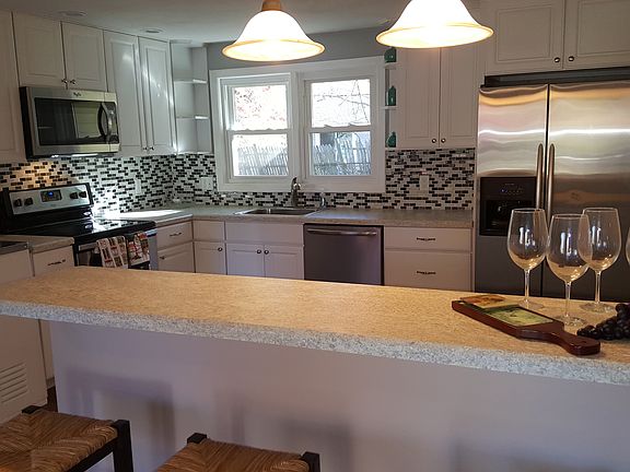 Kitchen with counter/stools