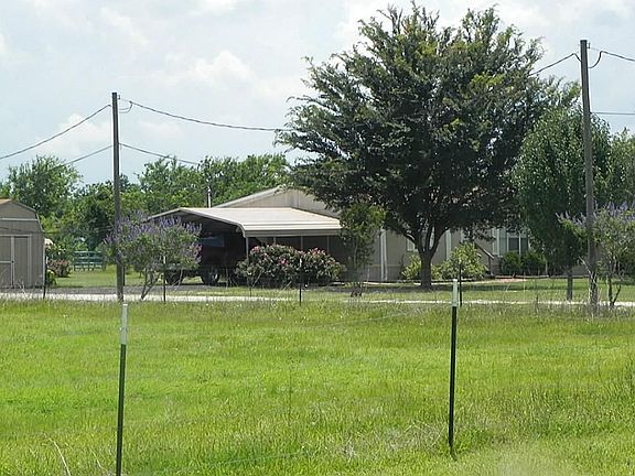 SIDE VIEW OF HOME ON 4 ACRES